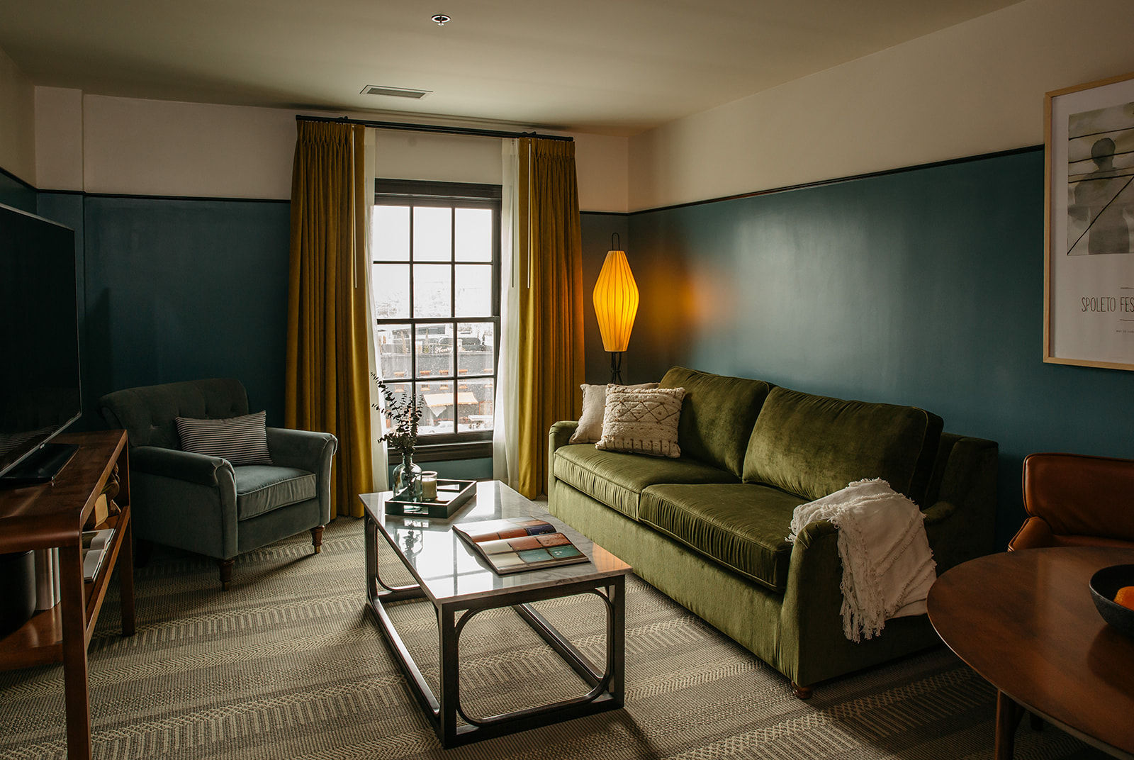 image Spacious and elegant living area, designed for relaxation with plush seating and soft lighting.