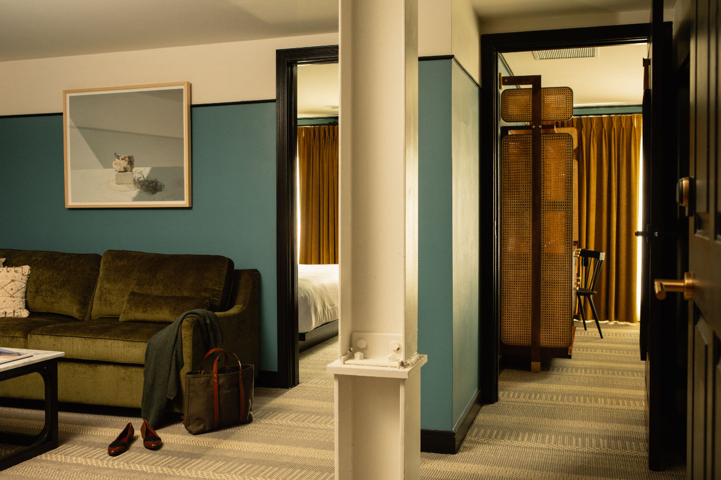 image Spacious and stylish suite, where rich textures and deep hues create a cozy yet refined retreat.