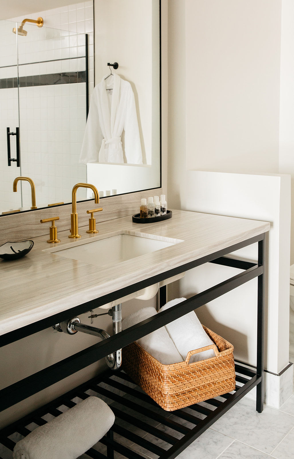 image Sleek and modern bathroom design, where elegant finishes and warm lighting create a spa-like retreat.