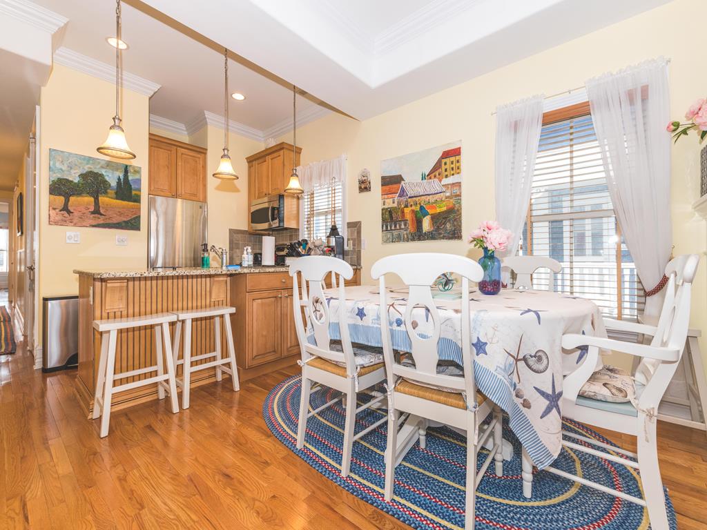 image Bright dining space with coastal decor perfect for gathering.