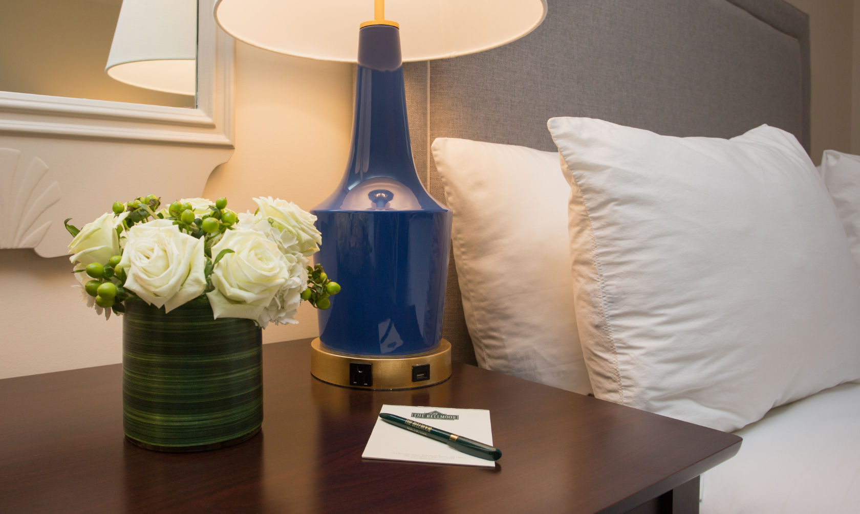 image Thoughtful bedside details with soft lighting create a cozy and inviting atmosphere.