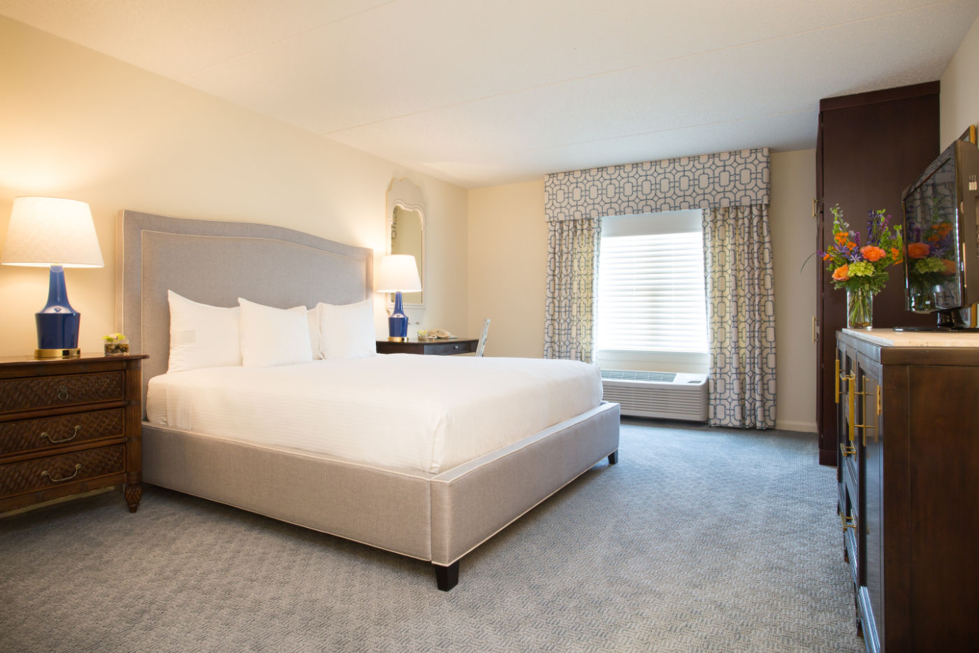 image A serene and inviting bedroom with plush bedding and warm lighting for ultimate relaxation.