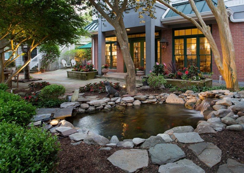 image A tranquil garden oasis with a serene koi pond, perfect for relaxation and reflection.