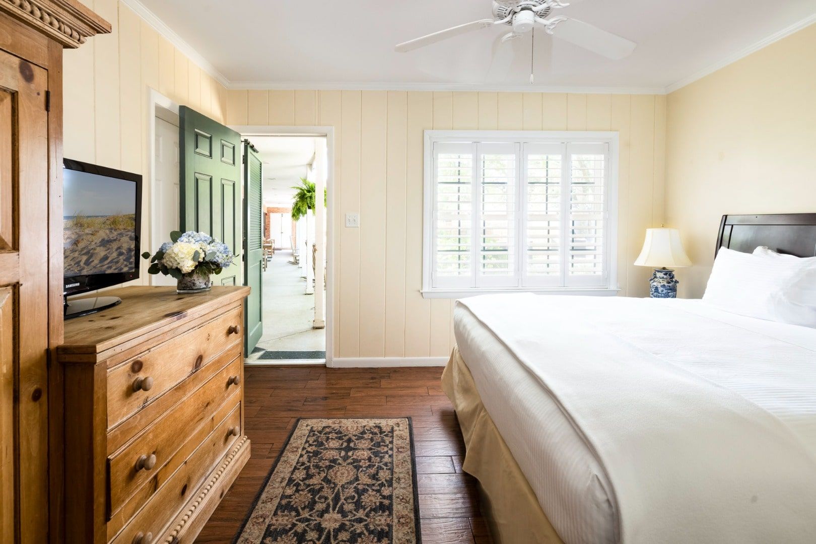 image A charming and sunlit bedroom with rustic touches and a peaceful ambiance.