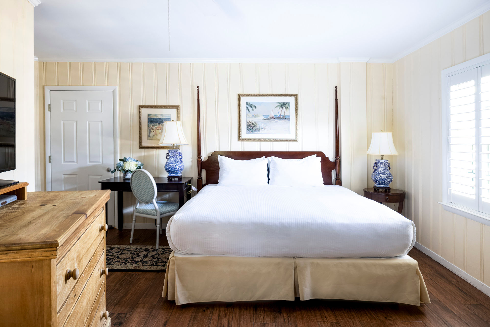 image A charming bedroom retreat with classic furnishings and warm, inviting tones.