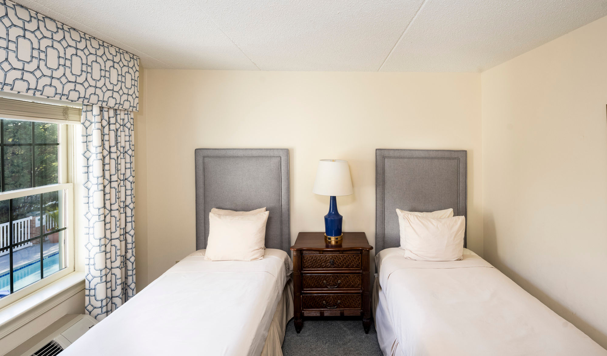 image A bright and airy twin room with plush bedding and a peaceful ambiance.