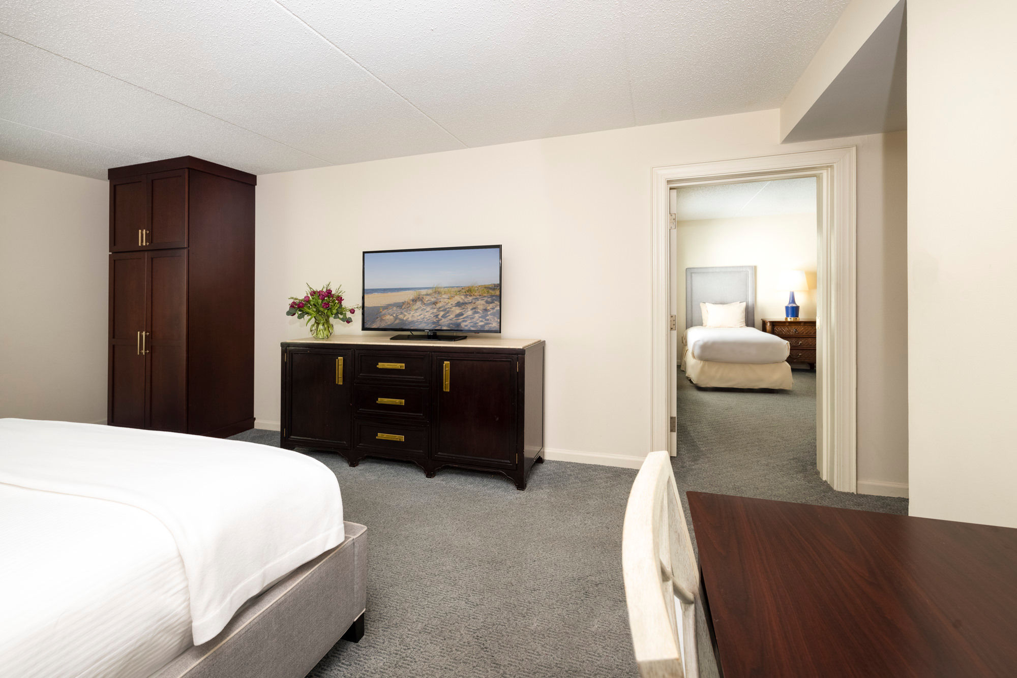 image A spacious and well-appointed guest room offering comfort and relaxation.