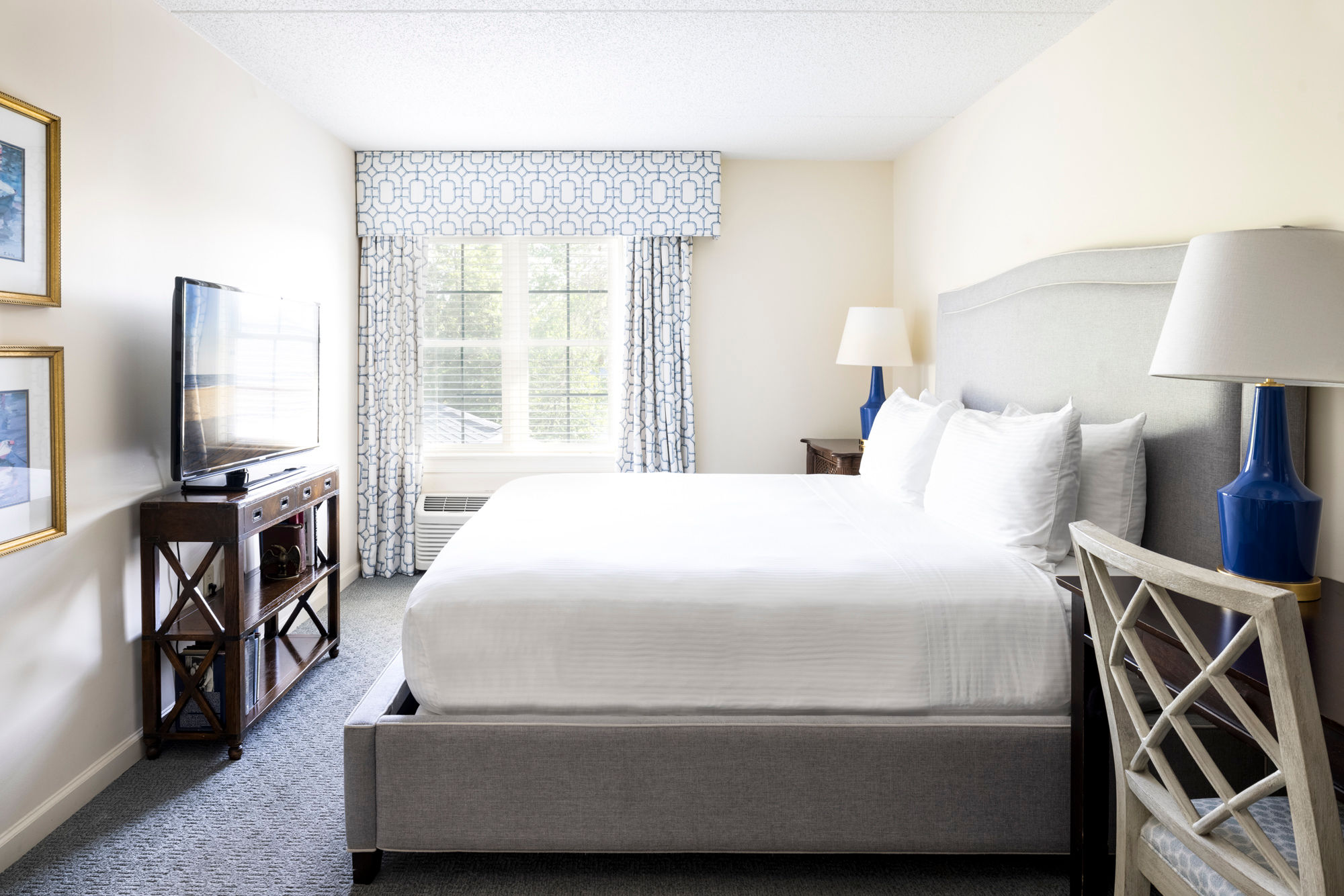 image Serene bedroom featuring a luxurious bed, soft natural light, and stylish furnishings for restful nights.