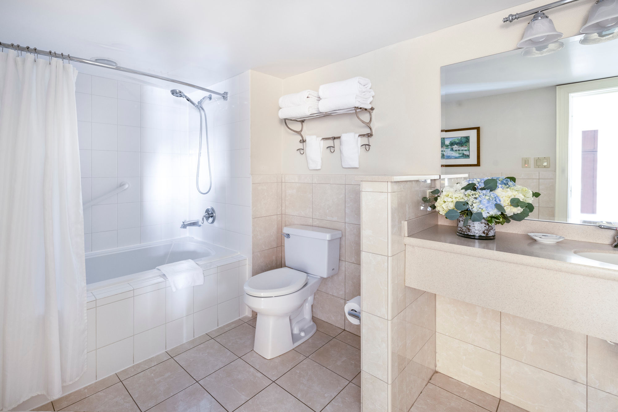 image Refreshing bathroom with a spacious vanity, well-lit mirror, and modern fixtures for a spa-like experience.