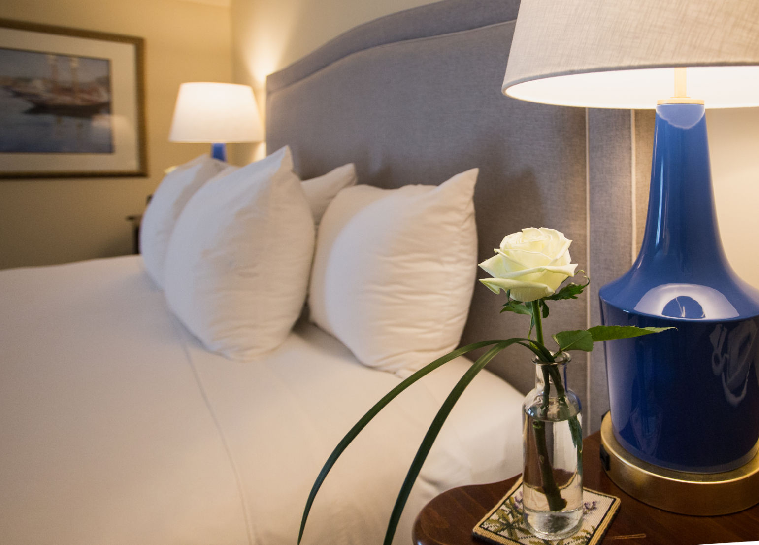 image Thoughtful details and warm lighting create a cozy and inviting bedside retreat.