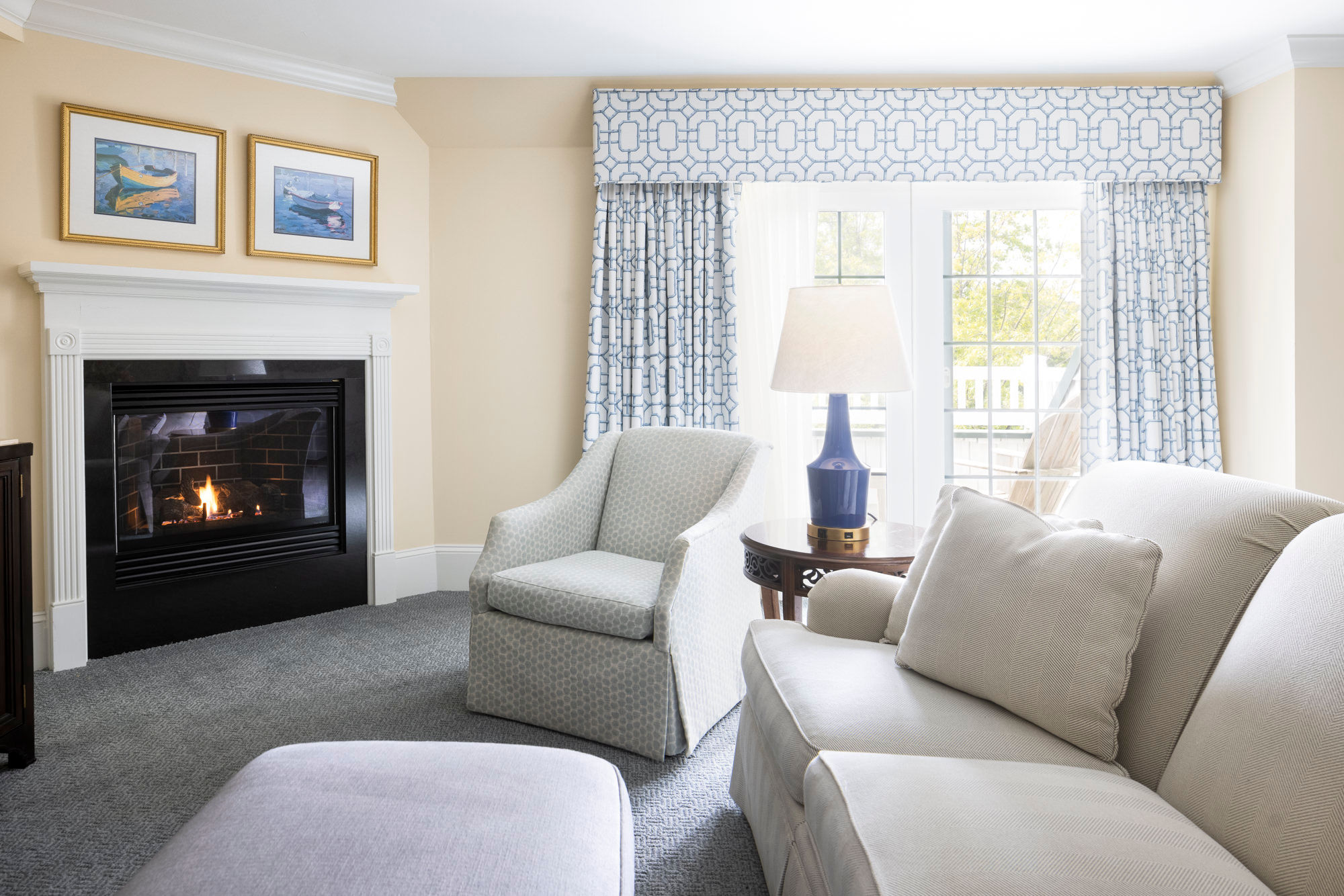 image A cozy fireplace and sunlit seating create the perfect space to relax and unwind.