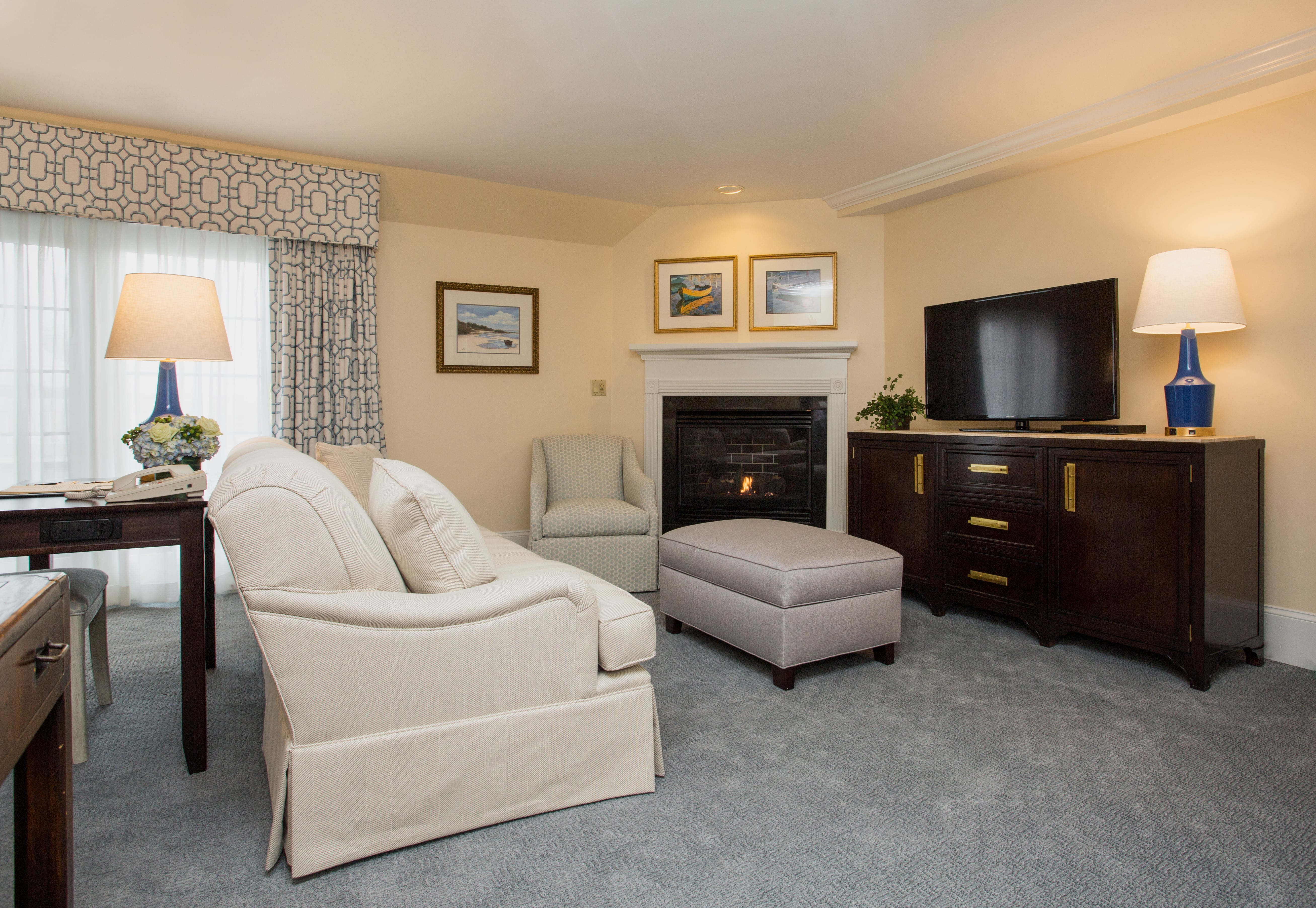 image A cozy fireside nook with elegant details, perfect for both work and relaxation.