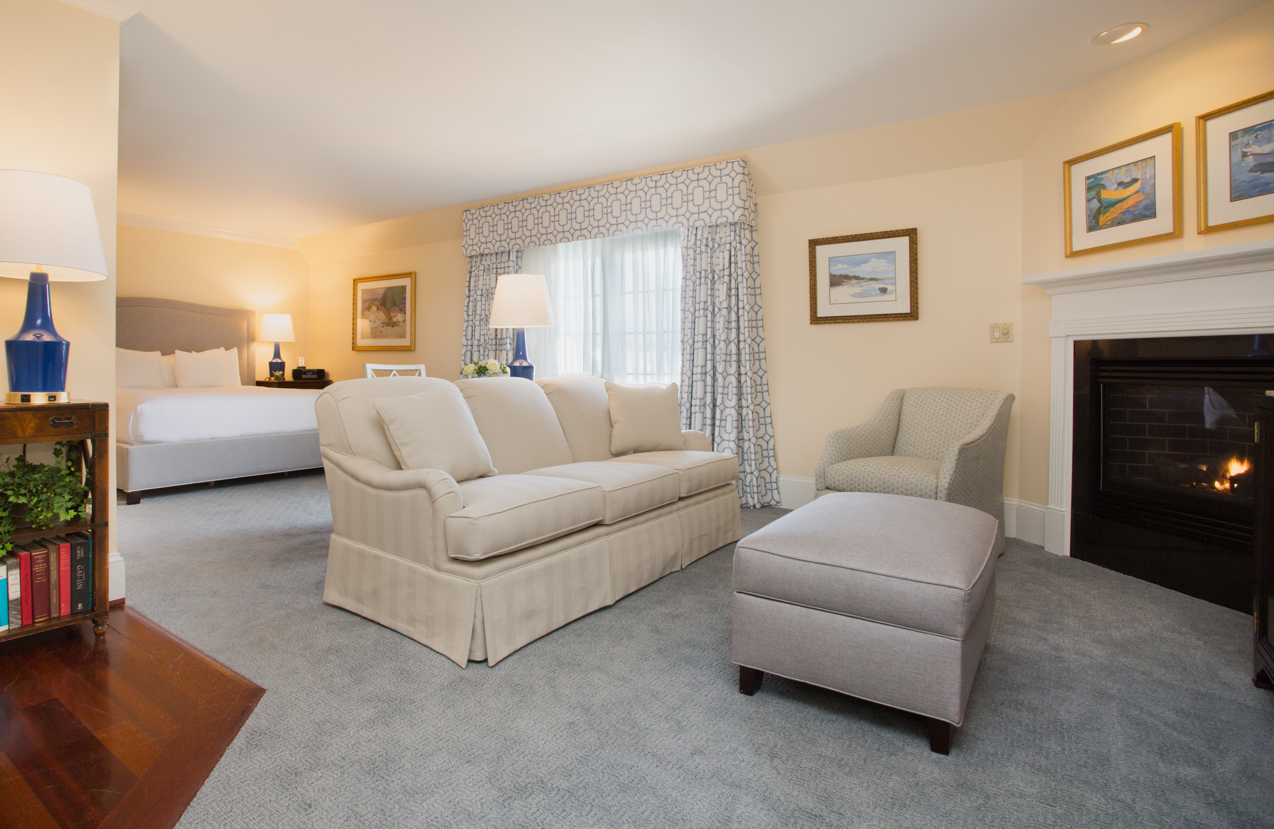image A spacious and elegantly designed suite, perfect for unwinding by the fire in absolute comfort.