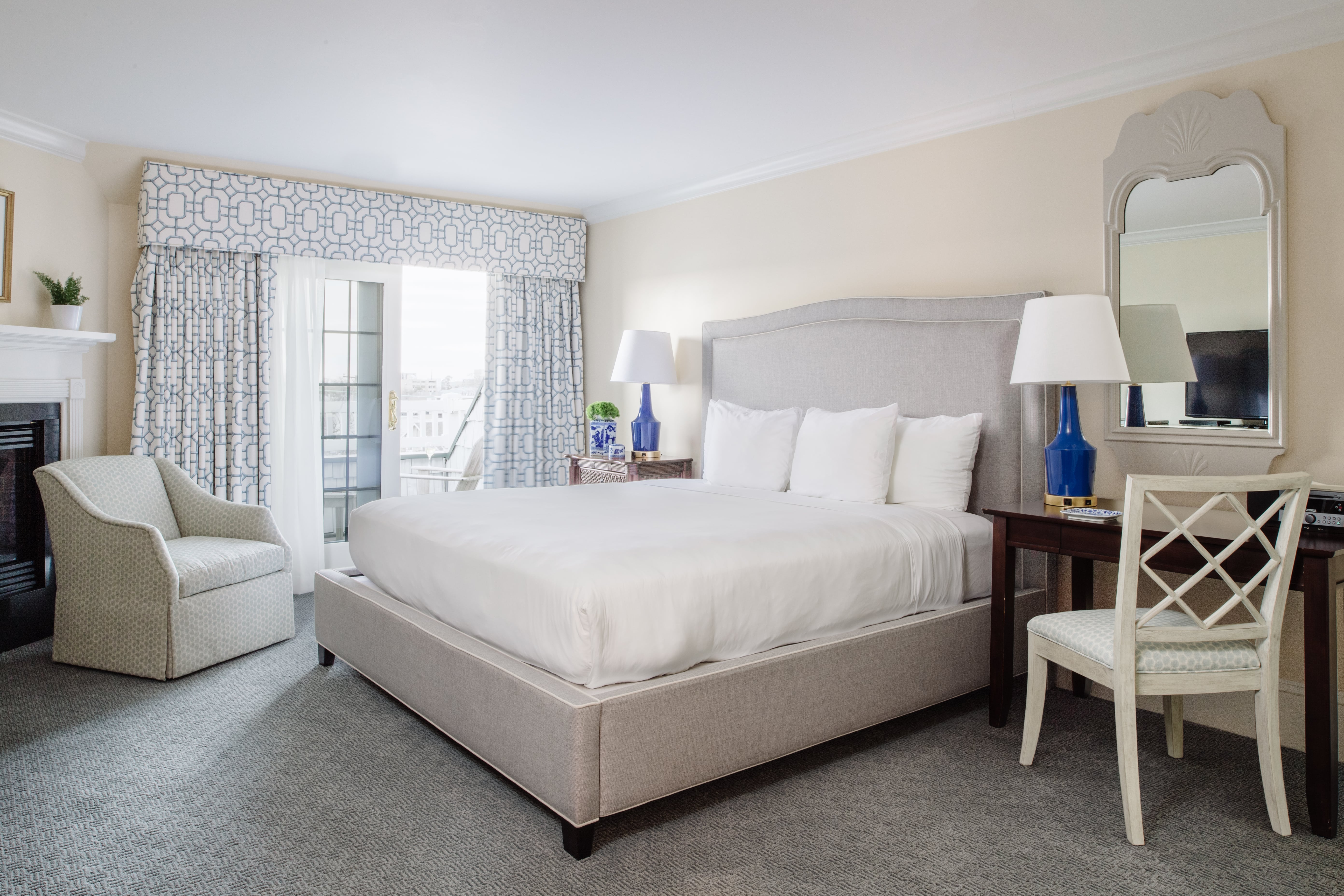 image Plush bedding, natural light, and refined decor combine for a restful and luxurious escape.
