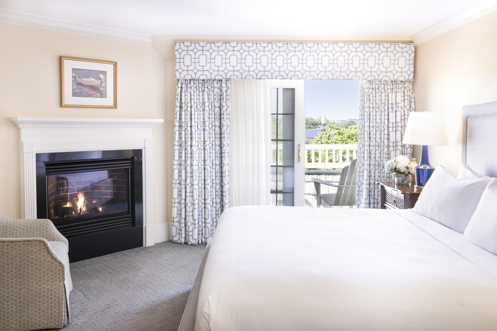 image A cozy fireplace and private balcony make this suite the perfect blend of warmth and serenity.