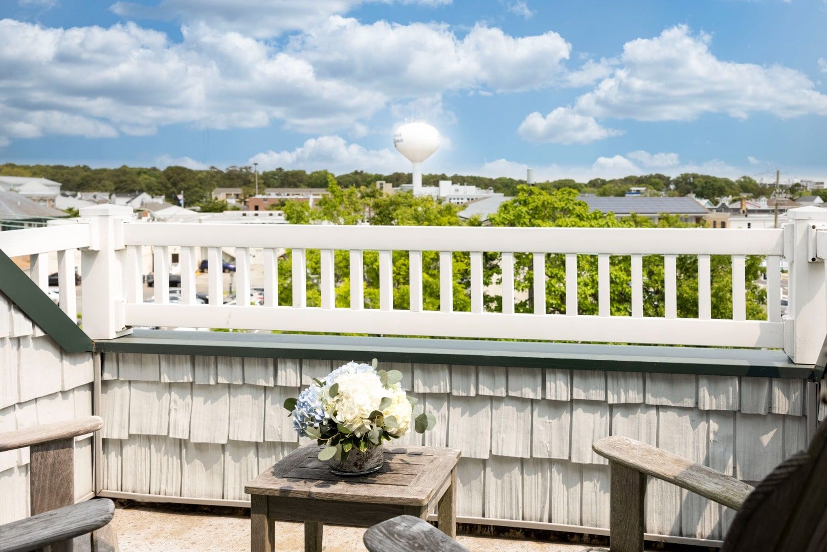 image Breathtaking rooftop views and a cozy seating area make this balcony the perfect spot to unwind.