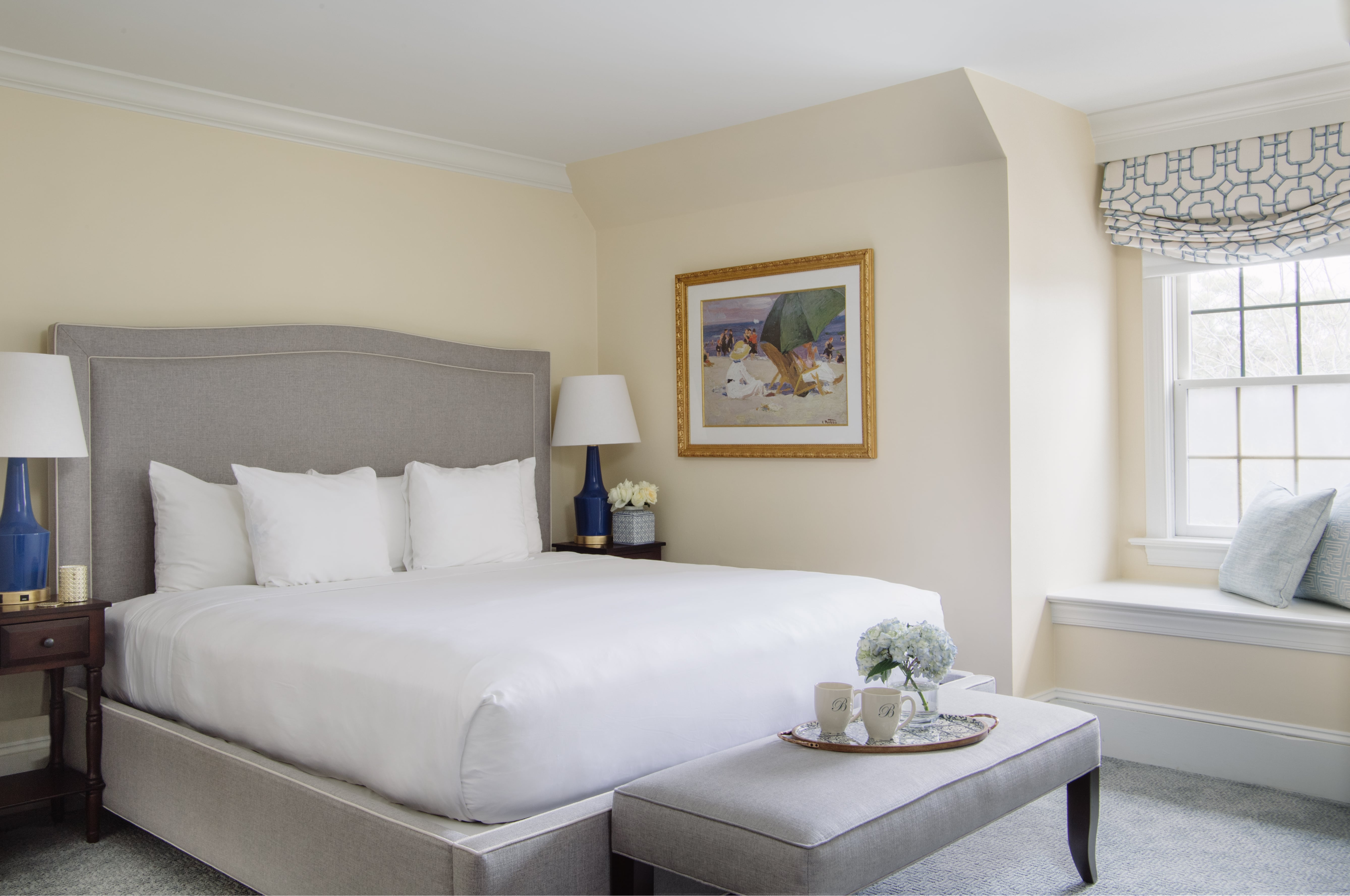 image Elegant décor and natural light make this inviting bedroom a true haven of comfort.