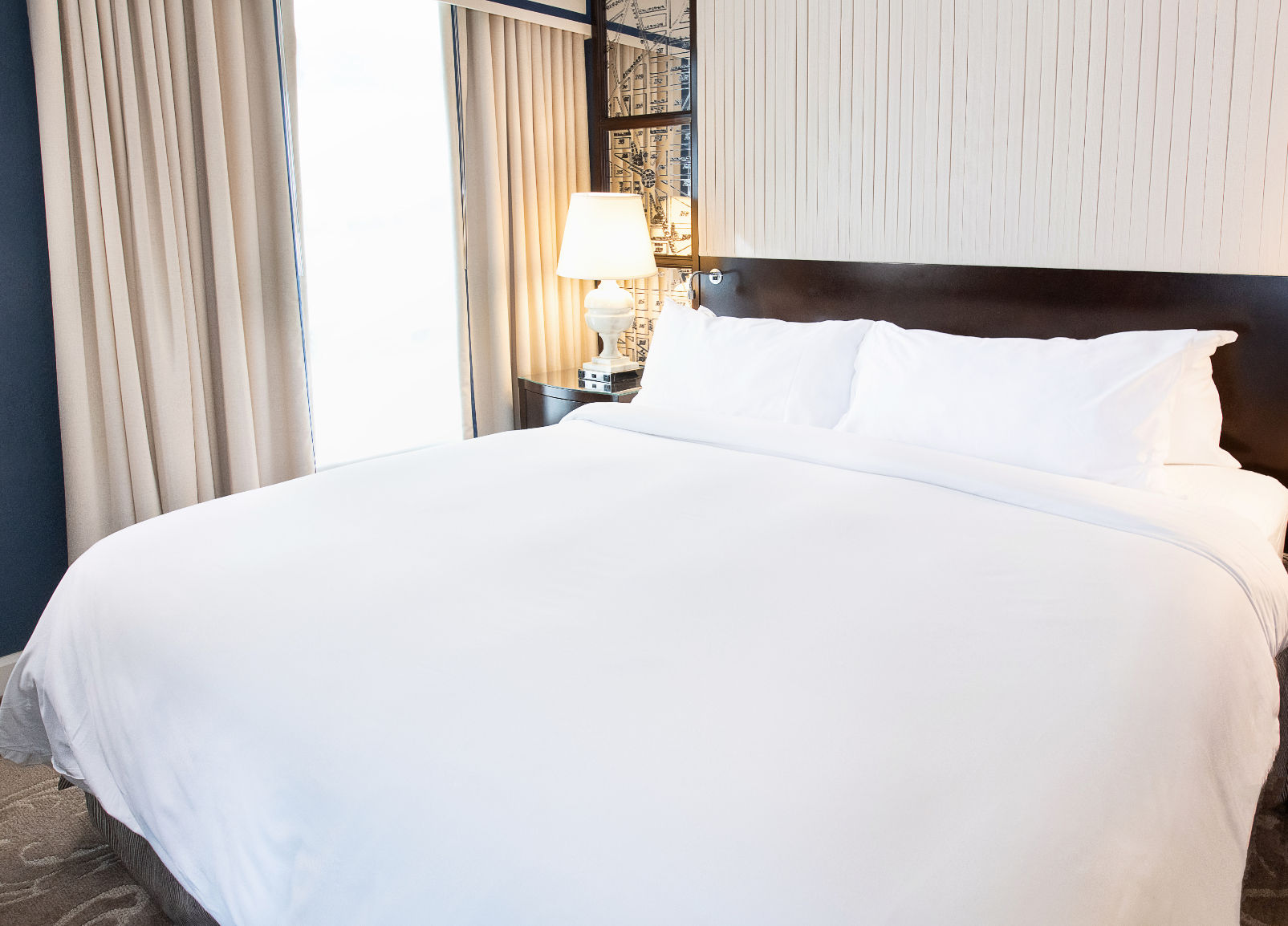image A peaceful retreat, where plush bedding and soft lighting create the perfect space to unwind.