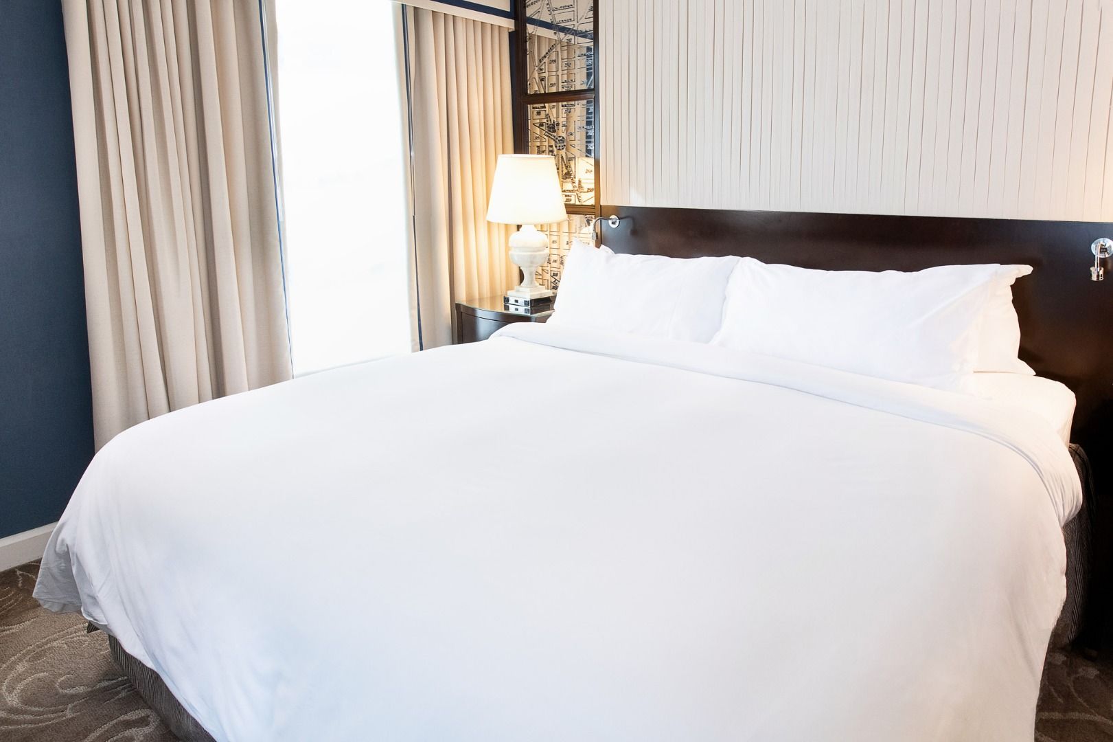 image A serene escape, where plush bedding and soft lighting create the perfect space to unwind.