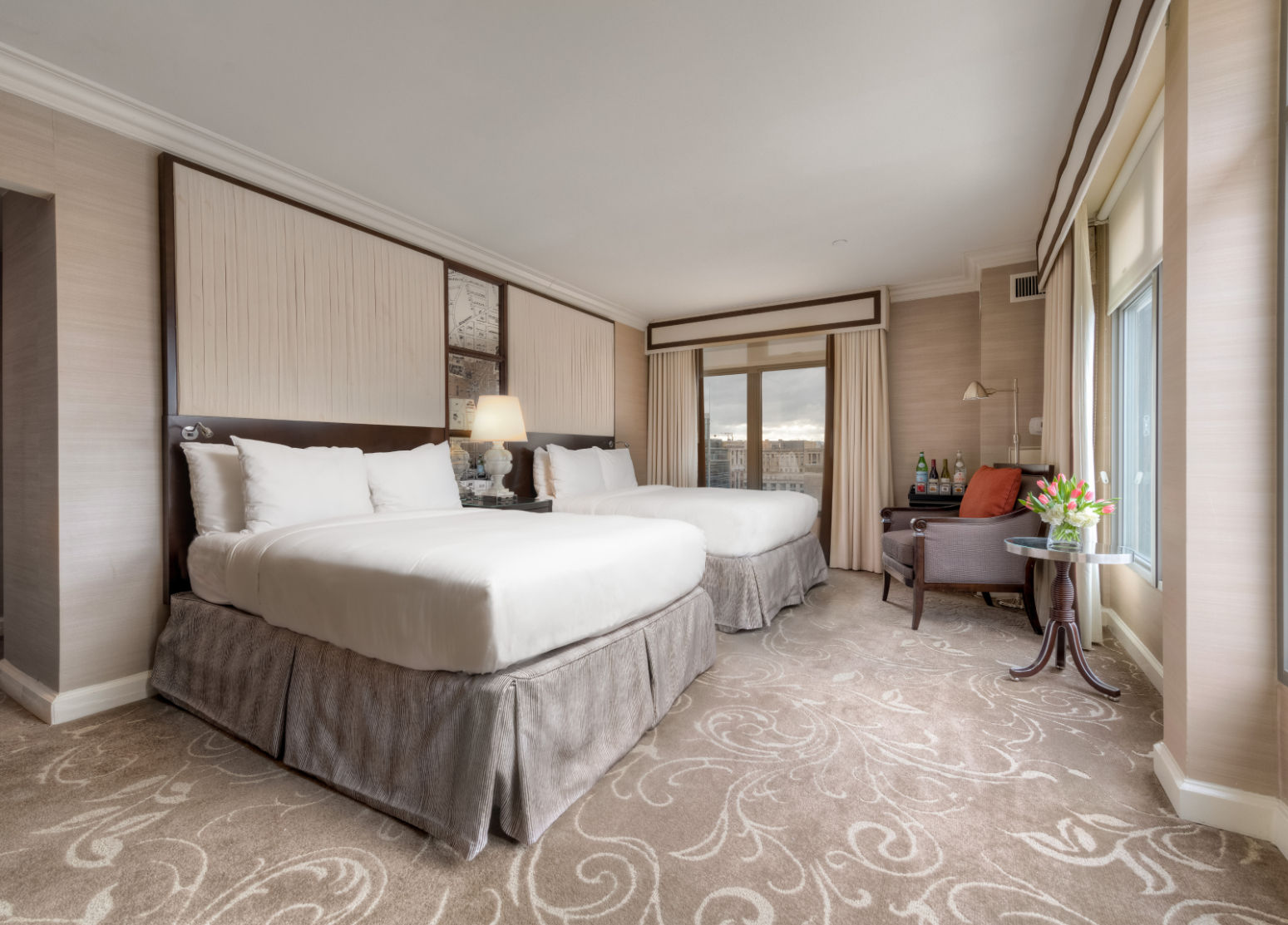 image Elegant and spacious retreat, where plush bedding, soft lighting, and refined décor create the perfect stay.