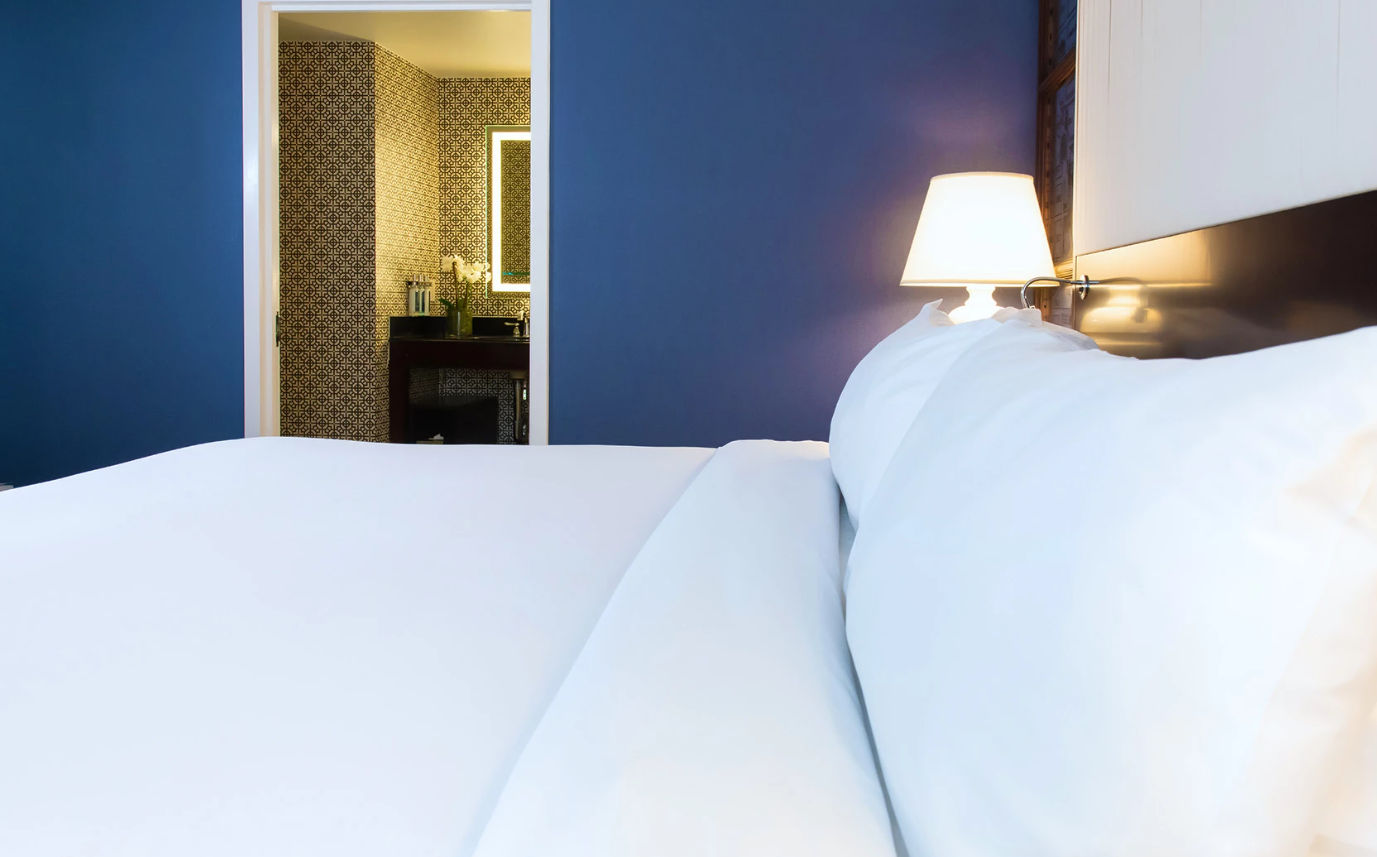 image Crisp linens and plush pillows, creating the perfect retreat for restful nights and refreshed mornings.