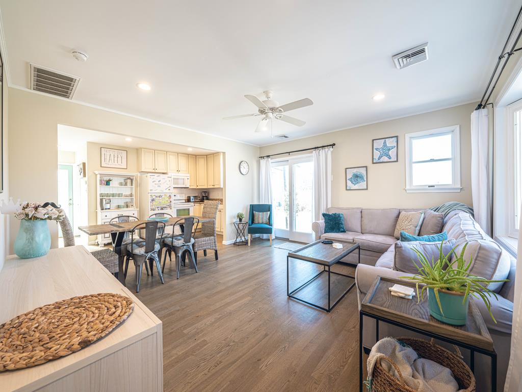 image Bright and airy layout with a seamless flow between the kitchen and living areas.
