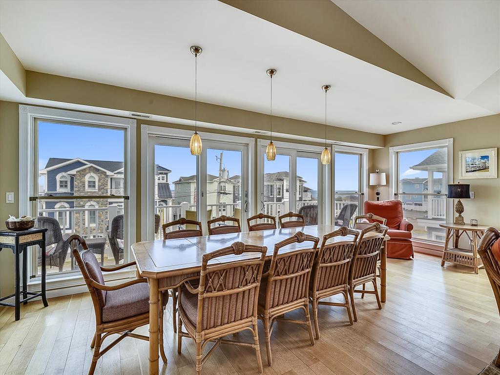 image Spacious dining area with large windows offering beautiful neighborhood views.