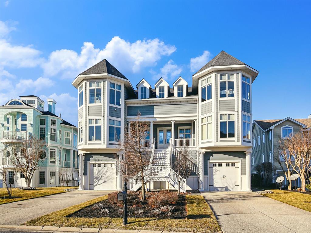 image Experience stunning bayfront views from this charming home featuring unique architectural details and spacious interiors.