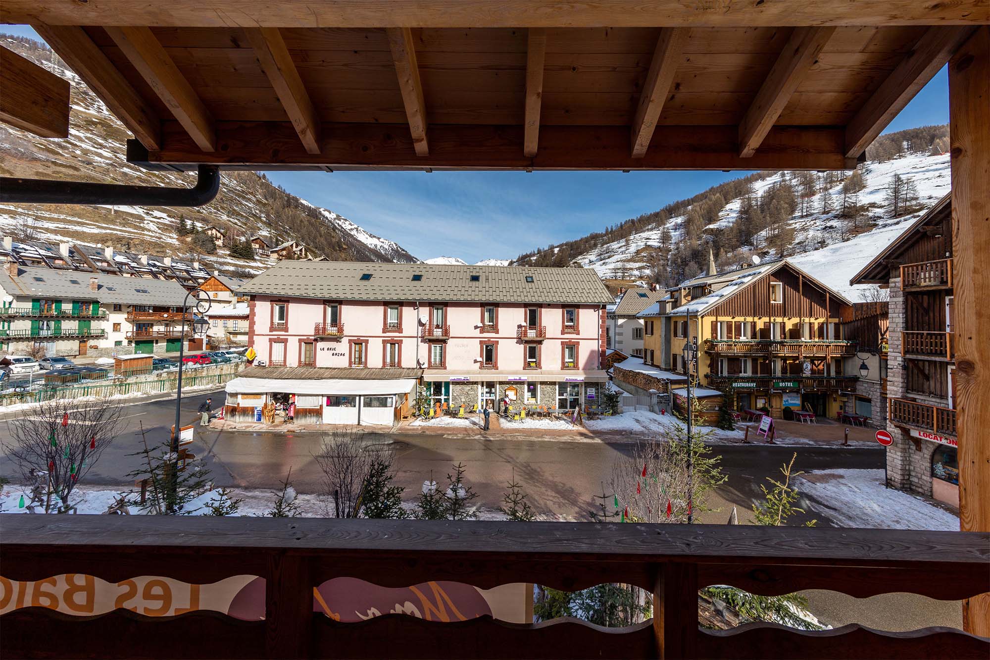 image A stunning balcony view capturing the beauty of the residence and the surrounding winter wonderland.