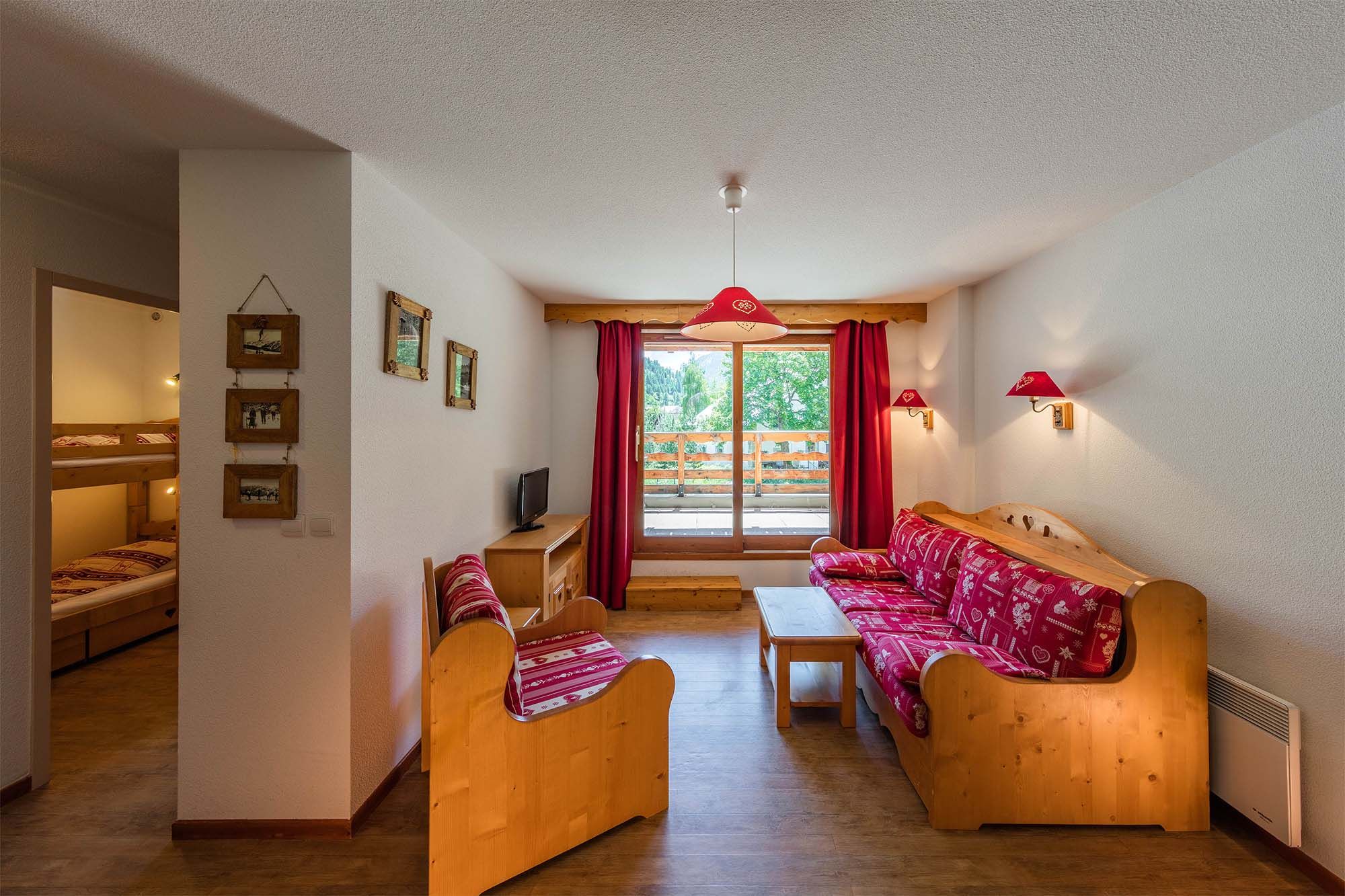 image A cosy and bright living area with traditional alpine decor, perfect for a relaxing mountain getaway