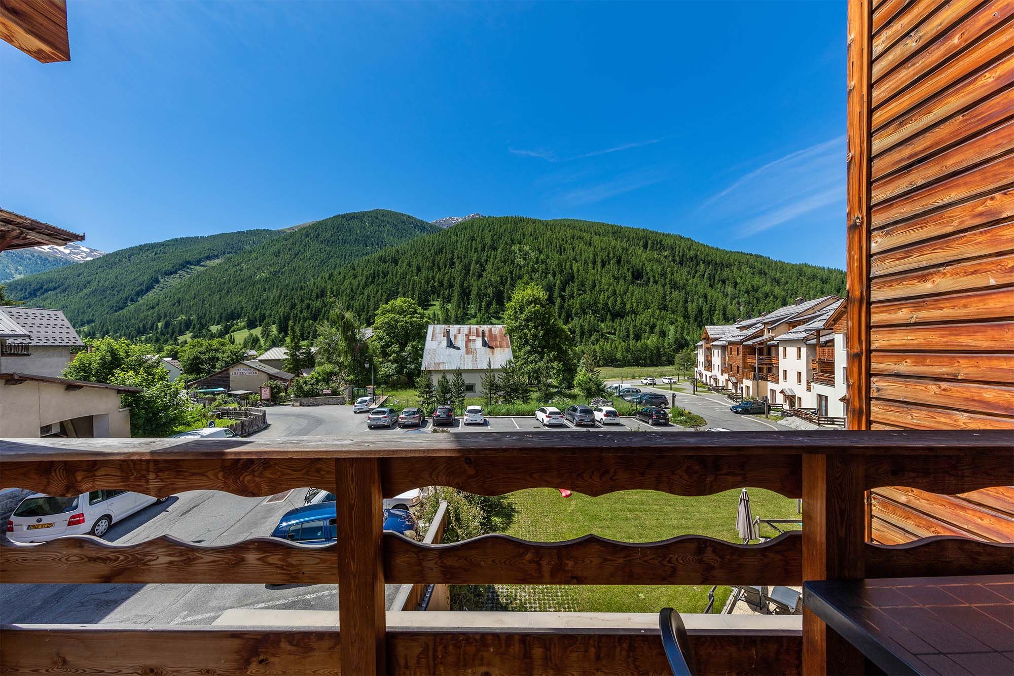 image A breathtaking balcony view of the lush green mountains, offering a serene and refreshing summer escape.