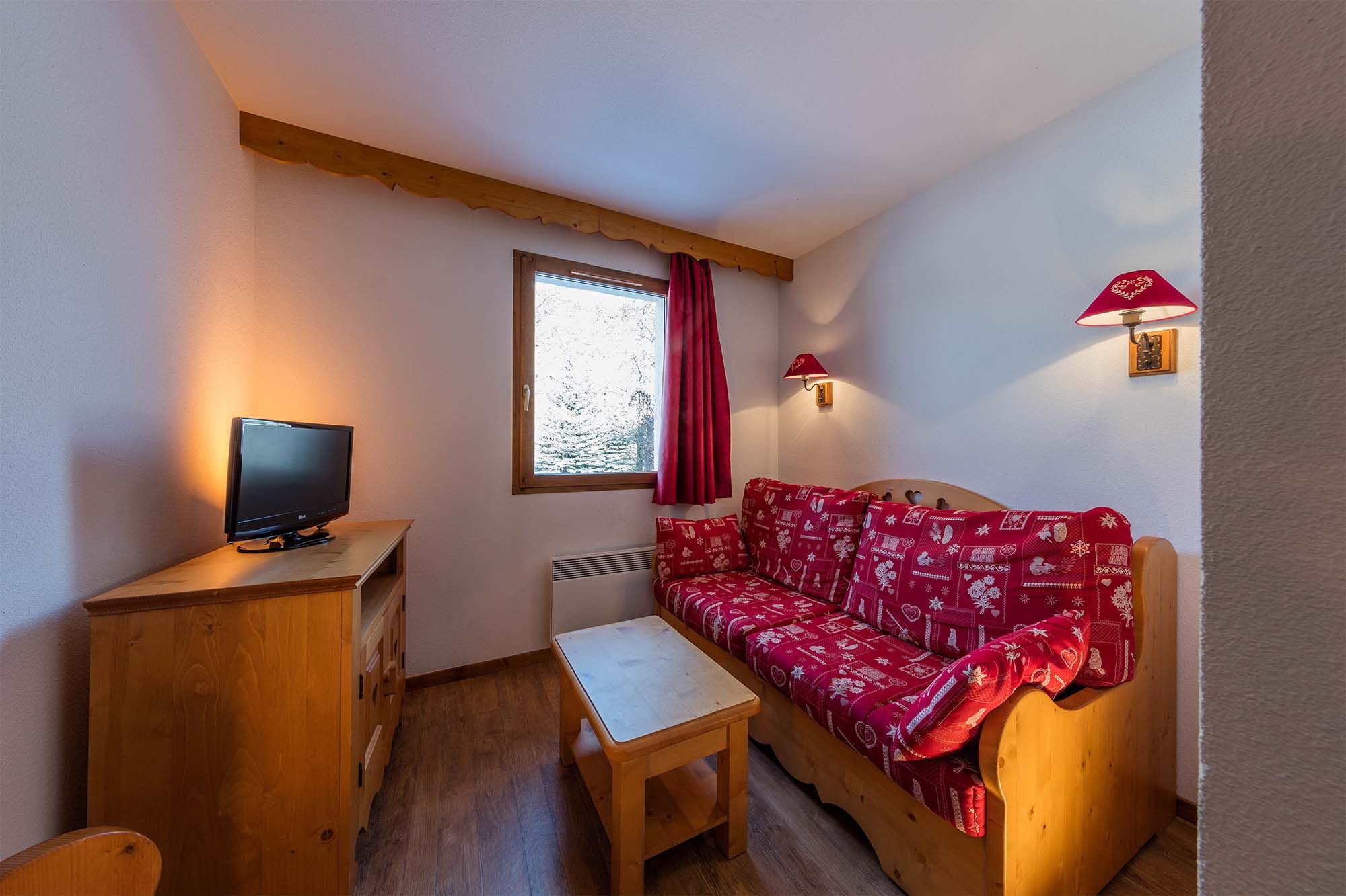 image A charming single-bed corner with warm decor, ideal for a peaceful night’s rest.