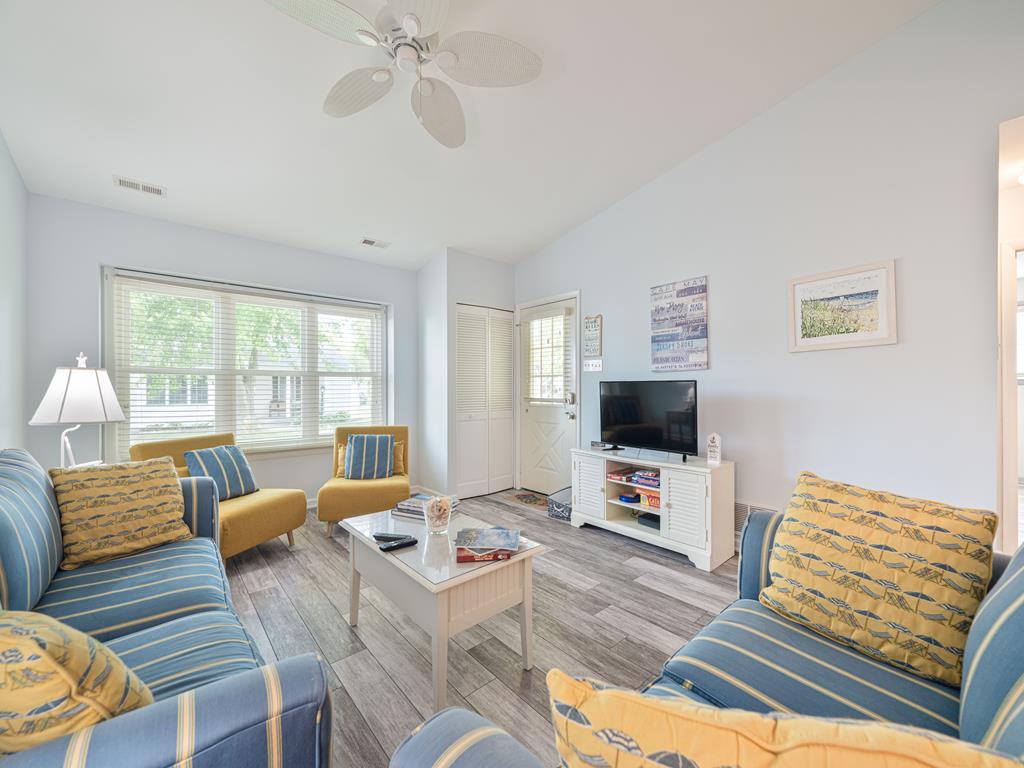 image Bright and inviting room with cozy seating and stylish coastal decor.