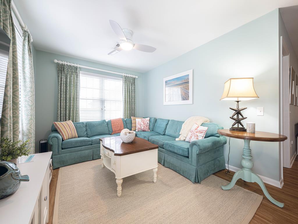 image A bright and inviting living room awaits, designed for comfort and entertainment with ample seating and an inviting atmosphere.