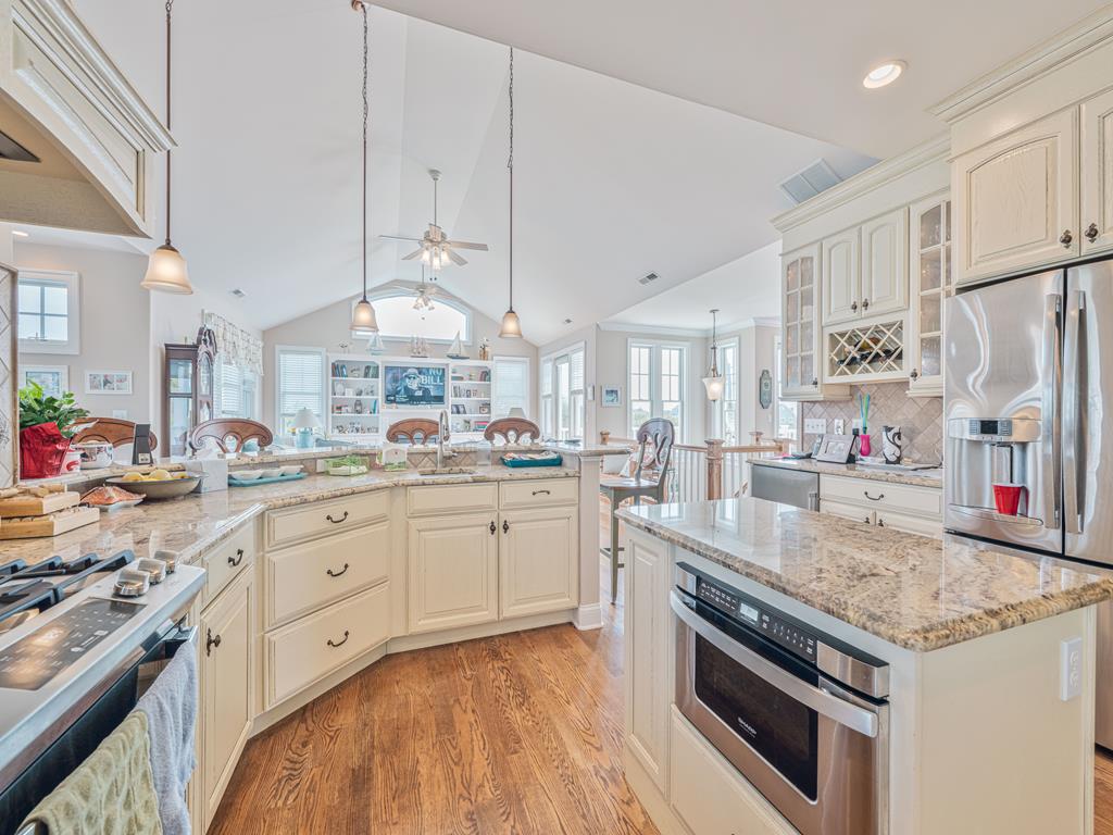 image Stunning gourmet kitchen with granite countertops, high-end appliances, and a spacious island for meal prep.