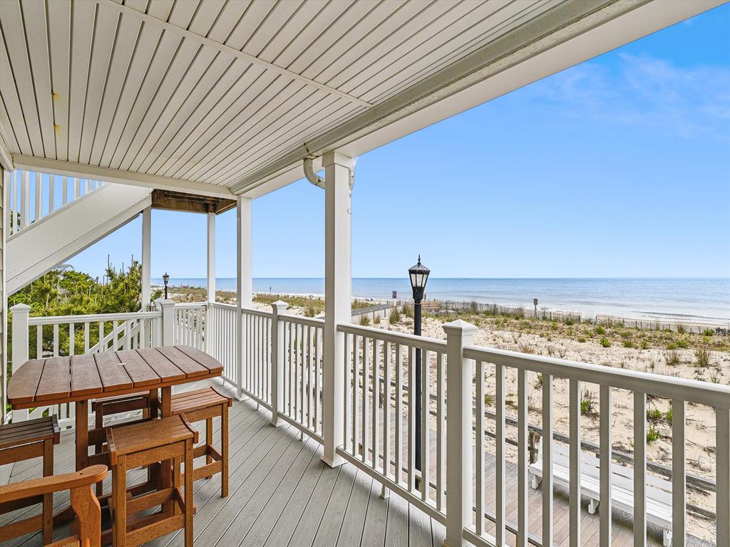 image Spacious ocean-facing balcony with a dining setup, ideal for al fresco meals with breathtaking views.