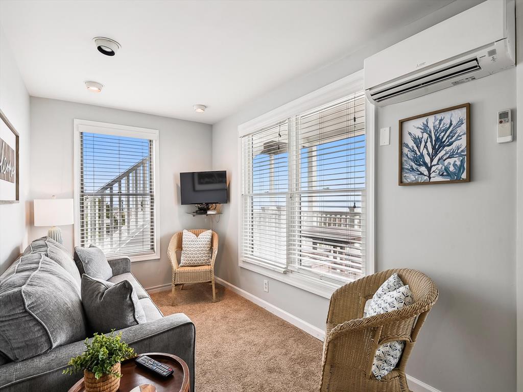 image Cozy living space with a comfortable sofa and entertainment setup, perfect for relaxing evenings.