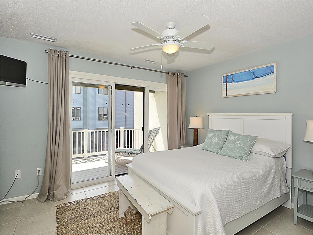 image Spacious bedroom with direct balcony access—wake up to ocean breezes and sunshine.