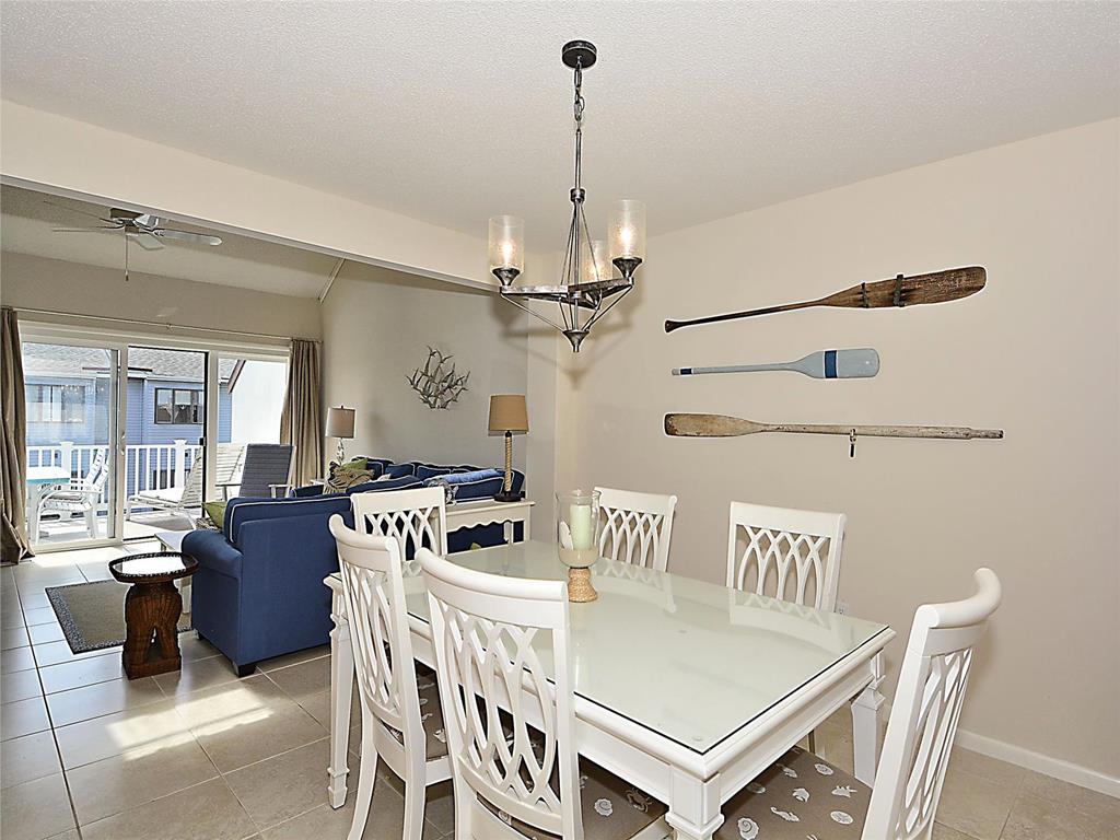 image Bright and airy dining area with coastal décor, ideal for enjoying meals with family and friends.