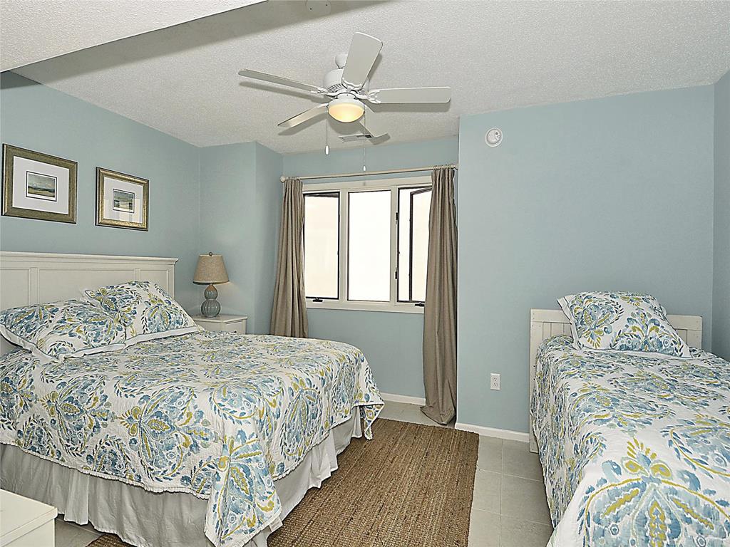 image Comfortable bedroom with charming beach-inspired décor, perfect for guests or kids.
