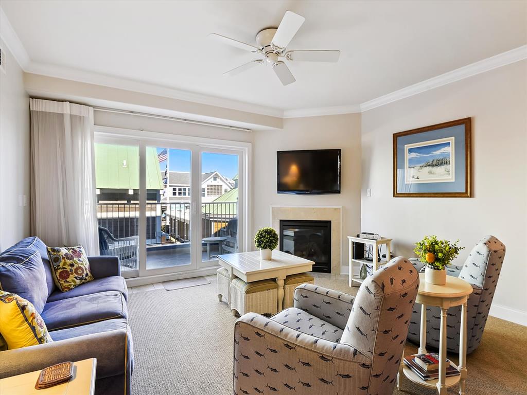 image Experience serene oceanfront living in this spacious condo, featuring inviting lounge areas bathed in natural light and direct access to breathtaking ocean views.