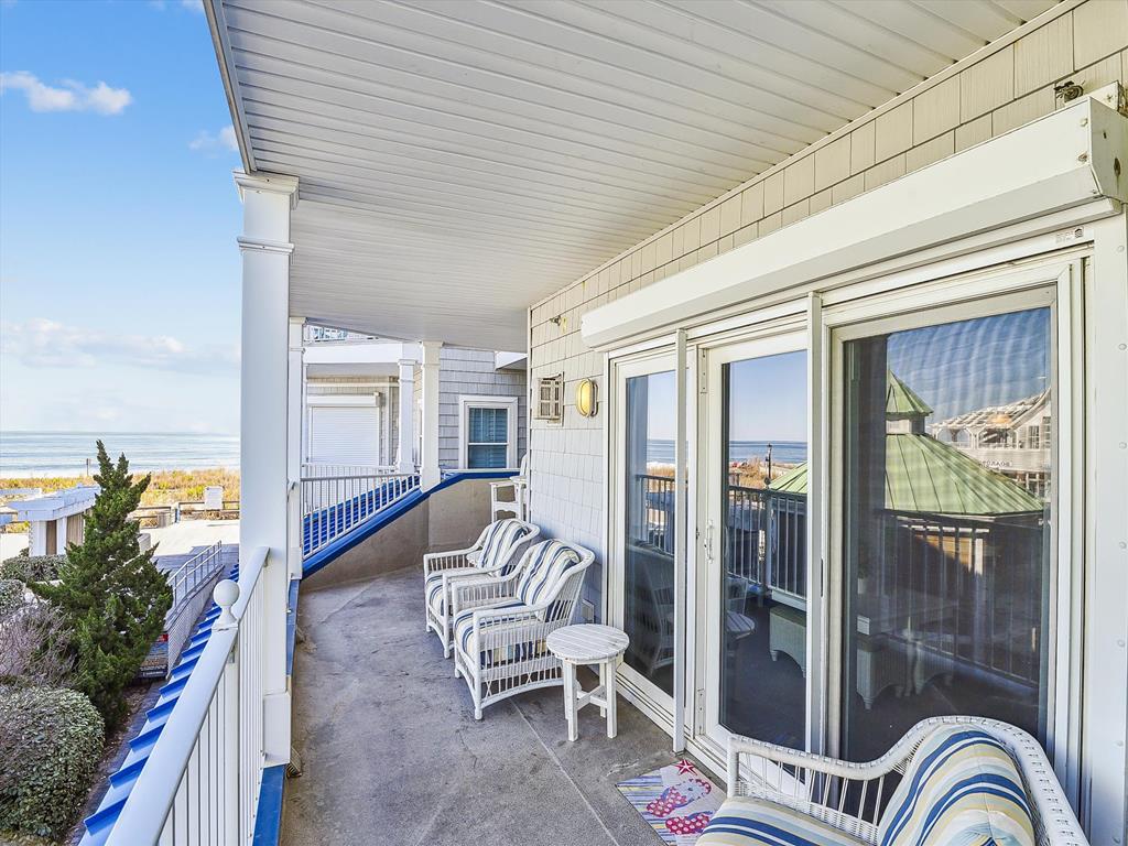 image This inviting balcony area offers gorgeous ocean vistas and a perfect space to unwind in the fresh coastal air.