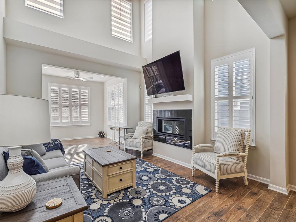 image The spacious great room exudes modern comfort with high ceilings, stylish decor, and a cozy fireplace, all designed to offer a relaxing indoor-outdoor lifestyle near the resort's premium leisure facilities.