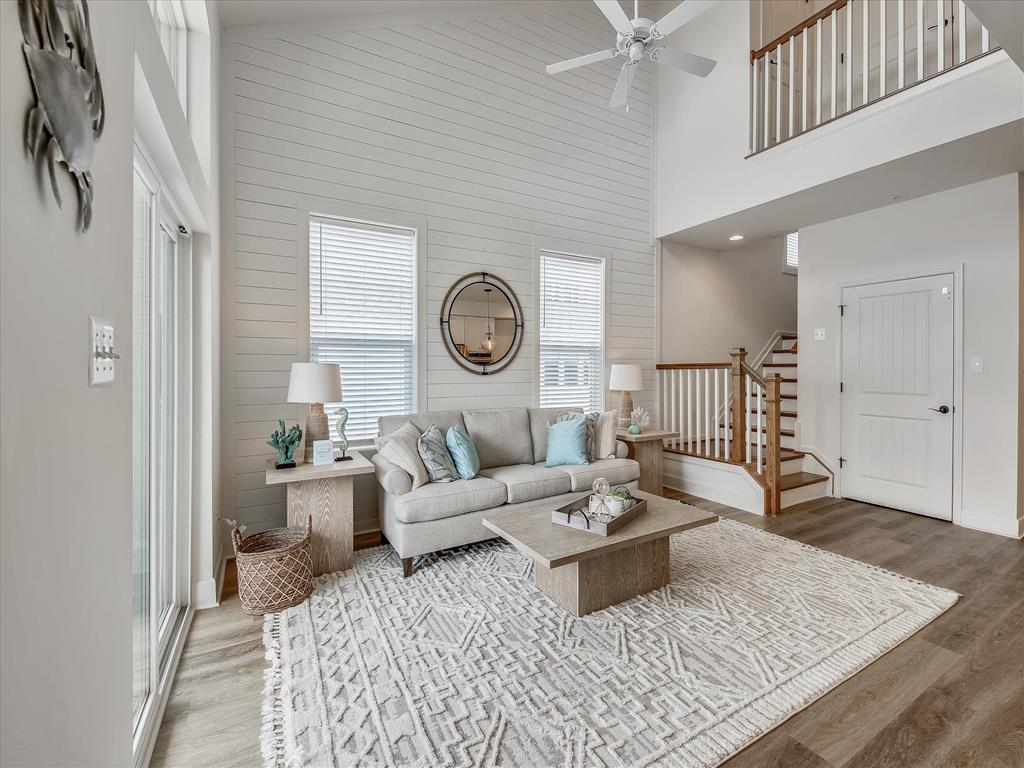 image Bright and airy dining space with a large table, perfect for gathering with loved ones while enjoying the home's open-concept design.