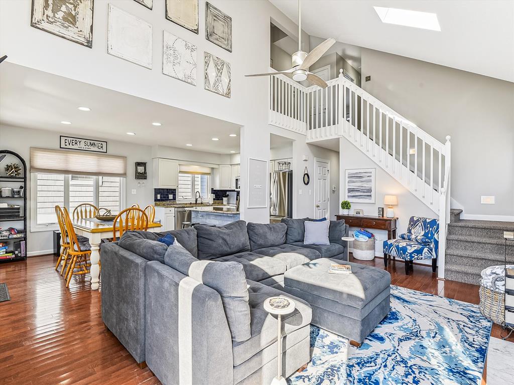 image Open-concept living area with stunning natural light, modern furnishings, and a breezy beach vibe for ultimate relaxation.