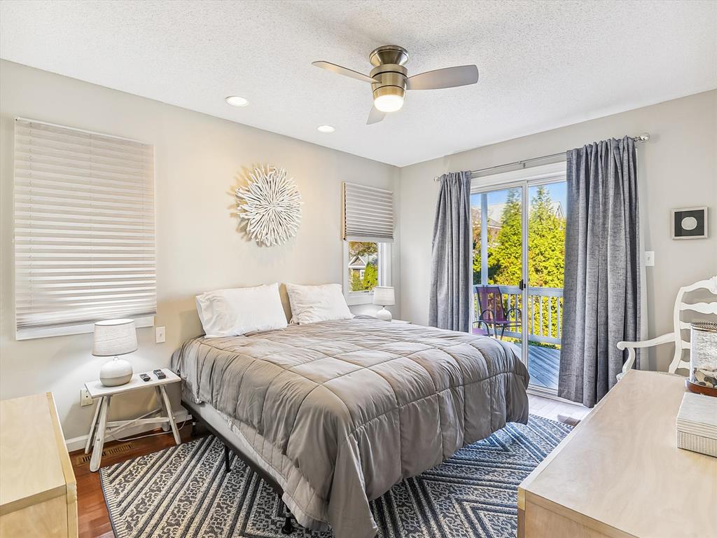 image Elegant and comfortable bedroom with soft linens, a ceiling fan, and peaceful decor for a restful night’s sleep.