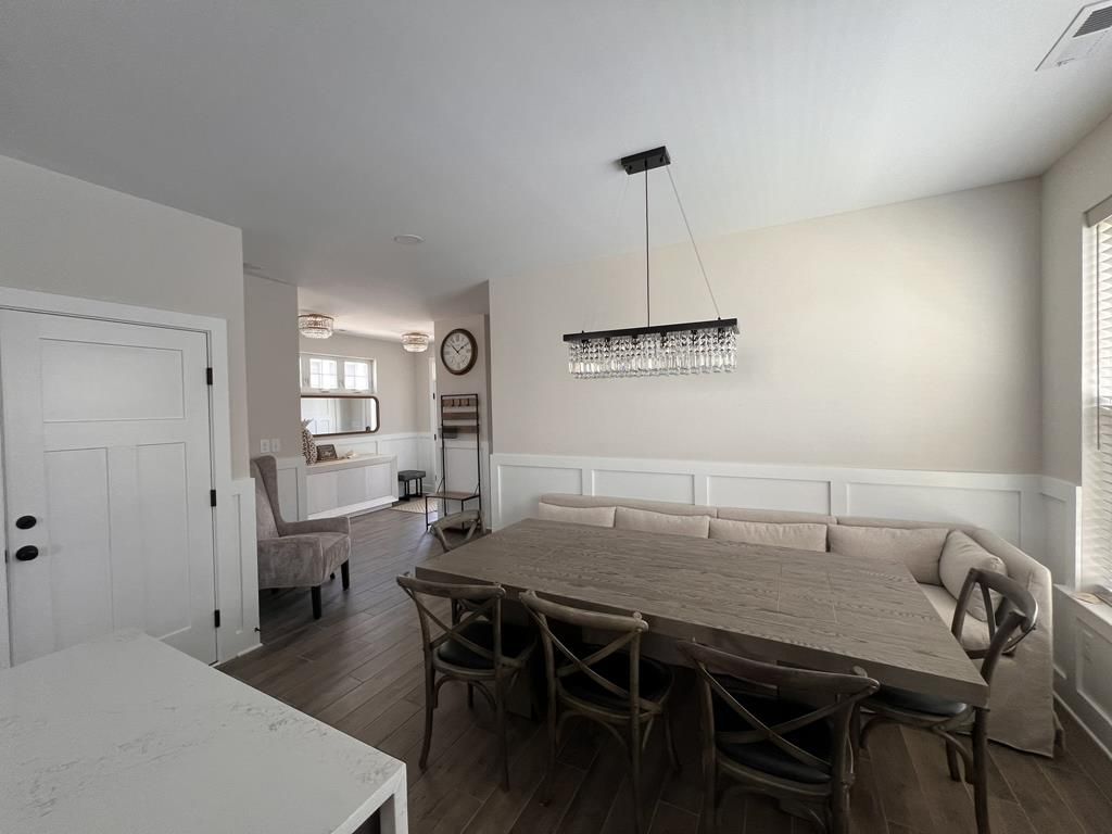 image Welcoming entryway with stylish decor and seating, setting the tone for a luxurious stay.