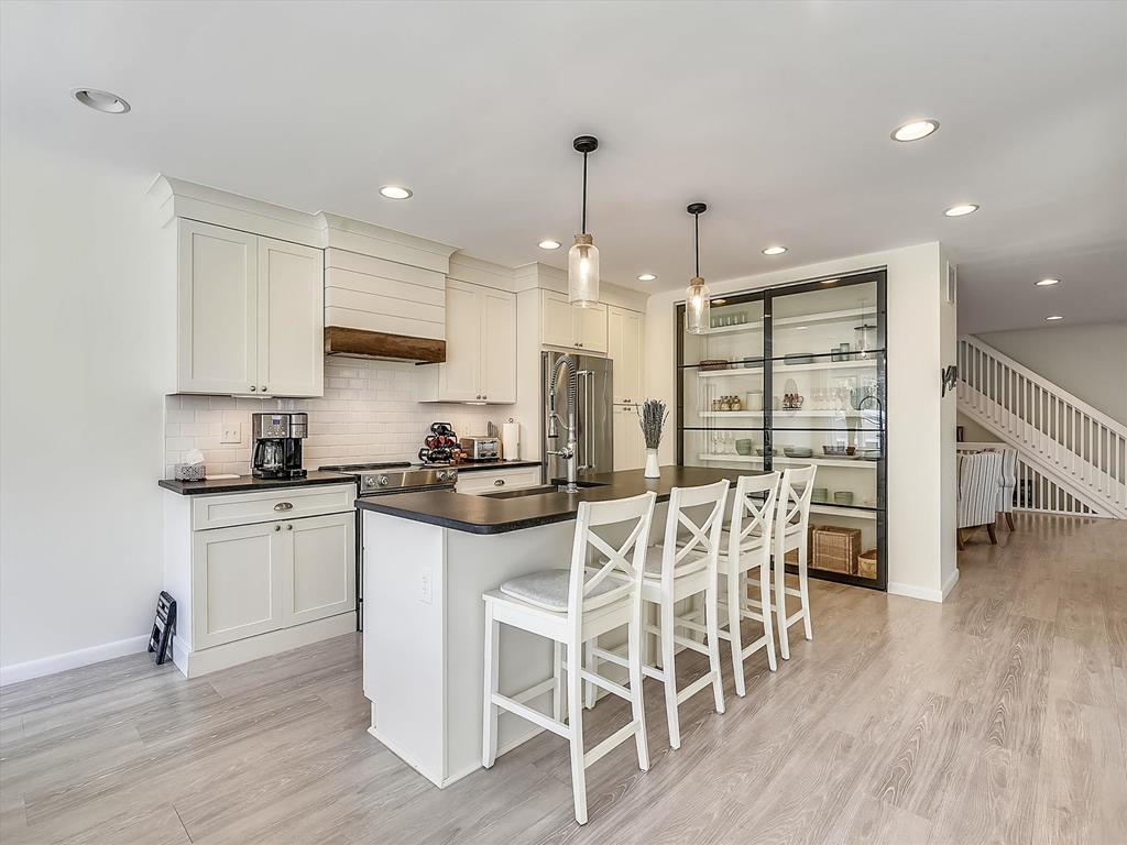image The modern kitchen is a chef’s delight, featuring sleek cabinetry, a spacious island, and high-end appliances, including a Keurig, perfect for serving up breakfast before heading out to the beach.