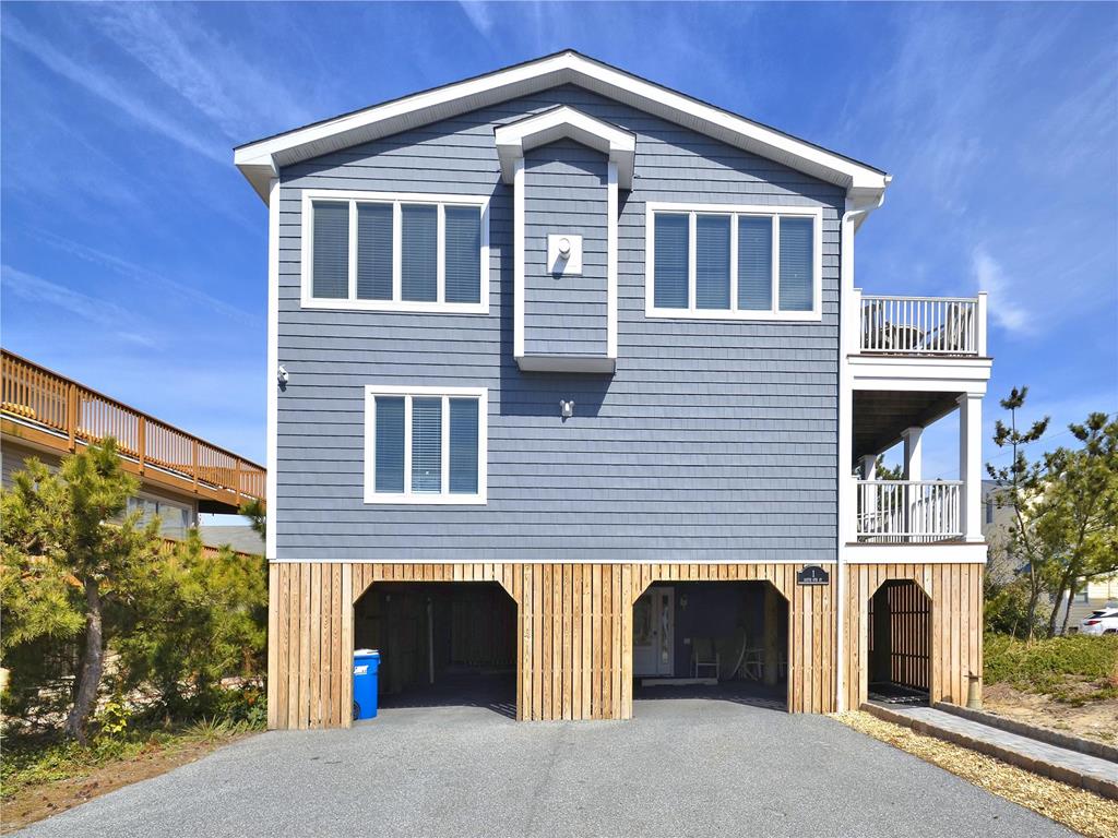 image This stunning 6-bedroom, 4.5-bath beach house features multiple ocean views and is just one lot away from the shore, boasting a beautiful exterior and ample outdoor decking.