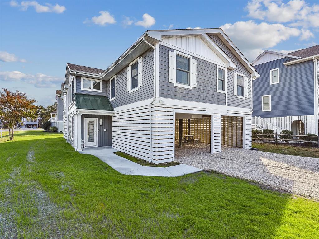 image This stunning coastal home features stylish modern renovations, boasting two primary suites and a spacious open living area with a 10' kitchen island, perfect for entertaining near Bethany Beach.